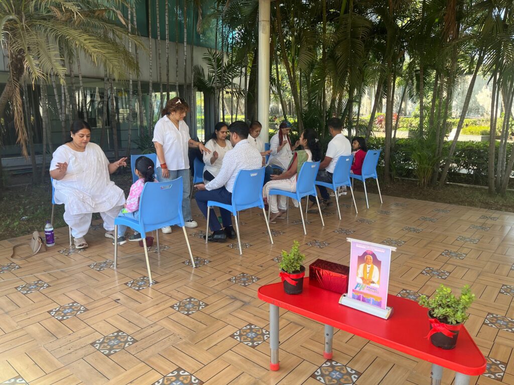 People gathered during a Pranic Healing Thane community program focused on healing, meditation, wellbeing, and conscious living.
